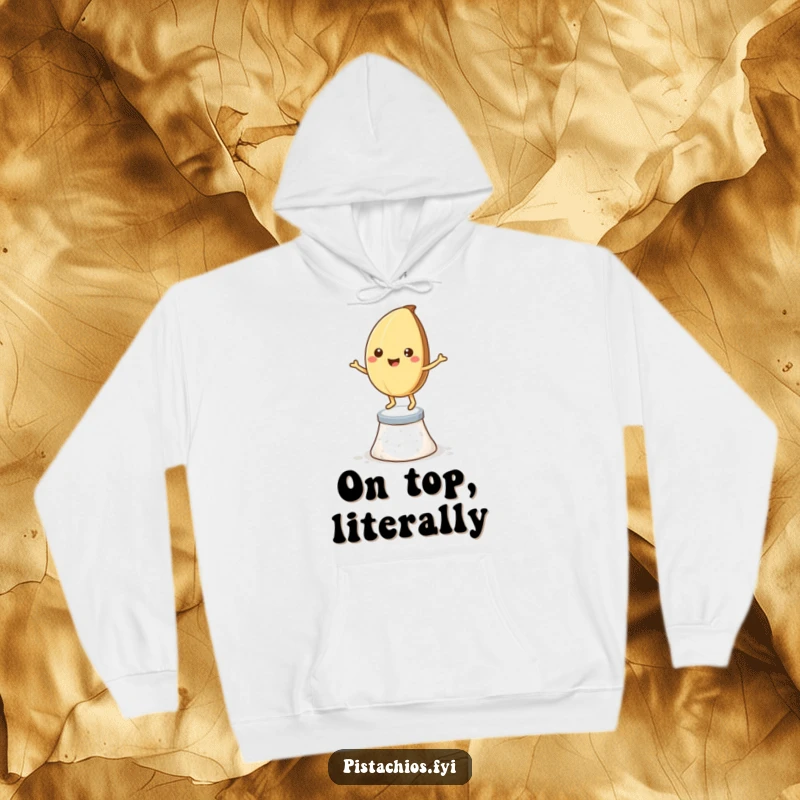 Funny hoodie: a happy pistachio nut dancing on a salt crystal pedestal, offering comfort and humor.