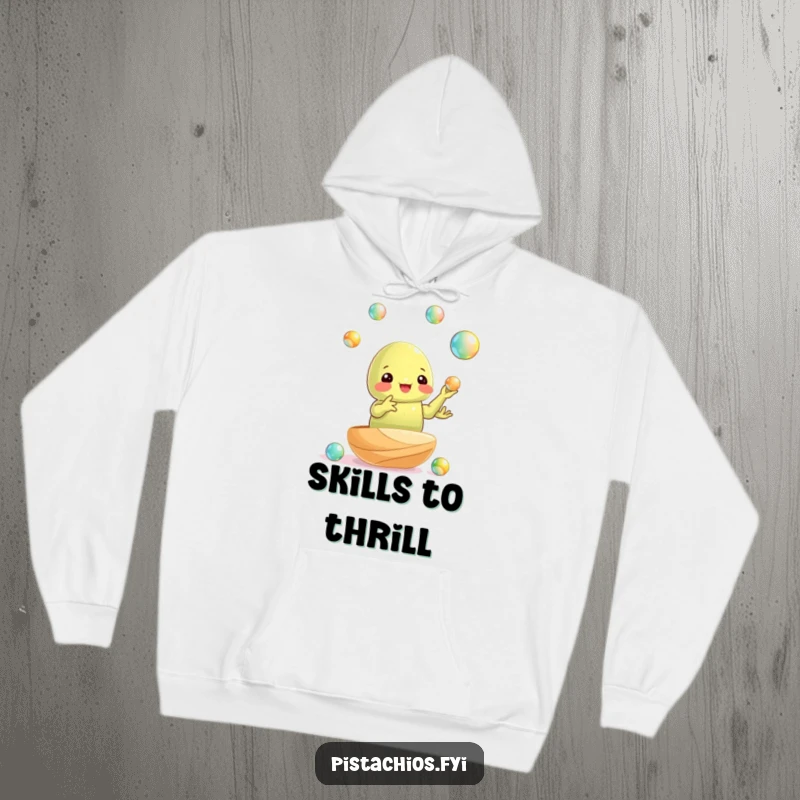 Funny hoodie: a pistachio nut juggling shiny marbles with surprising dexterity, perfect for cozy admiration.